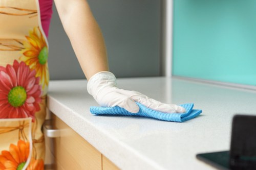 Technician using hot water extraction for deep carpet cleaning