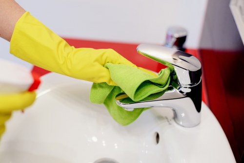 Bathroom cleaning setup with sanitizer and scrub brush