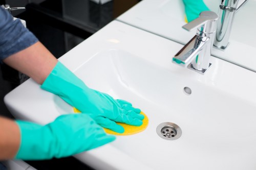 Commercial cleaning team sanitizing a workplace reception area